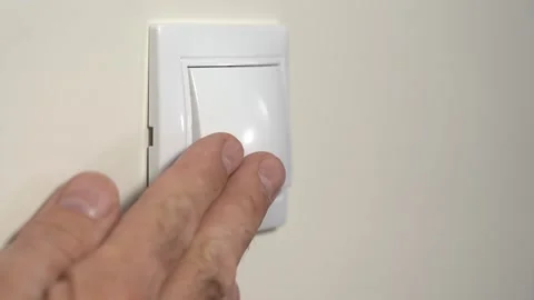 Switching Electric Lighting Off. An Elderly Man s Hand Turns Off the Light With Stock Footage 150930914