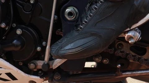 Switching gears on a motorcycle. Getting started. Riding. Racer. Sport motorc Stock Footage 119826340