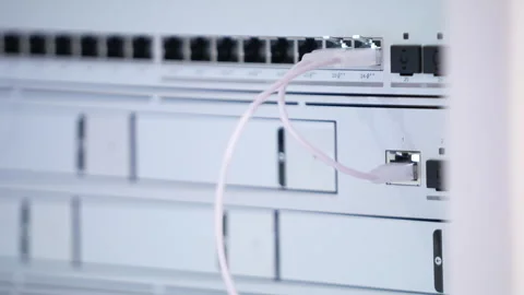 Switching hubs in IPS server room with cables and glowing lights Stock Footage 311733491