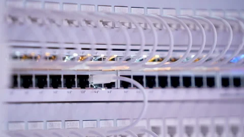 Switching hubs in IPS server room with cables and glowing lights Stock Footage 311733494