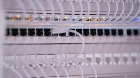 Switching hubs in IPS server room with cables and glowing lights Stock Footage 311733758