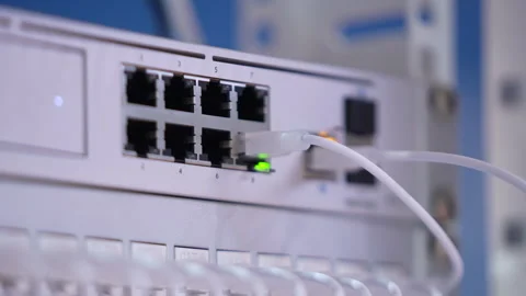Switching hubs in IPS server room with cables and glowing lights Stock Footage 311734029