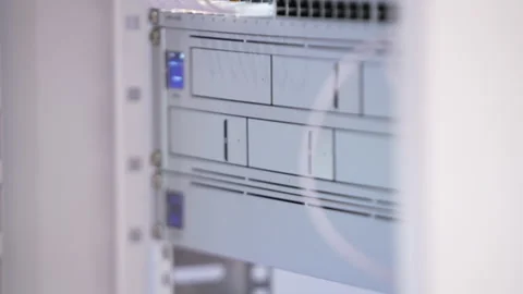 Switching hubs in IPS server room with cables and glowing lights Stock Footage 311734313