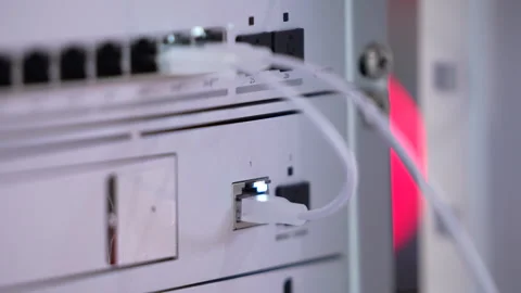 Switching hubs in IPS server room with cables and glowing lights Stock Footage 311734337