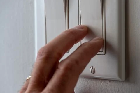 Switching off lights. Stock Photos