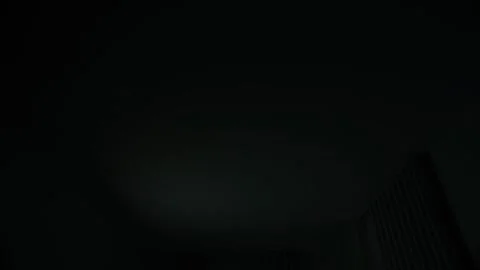 By switching off lights when not needed. Video stock 315450094