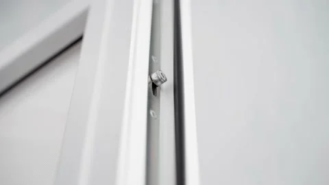 Switching modes of a plastic door. Moving mechanism inside a white plastic door Video stock 233567373