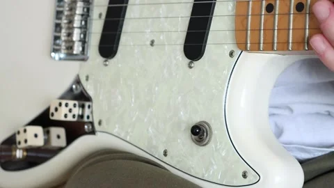 Switching neck and bridge pickup on electric guitar Stock Footage 333391177
