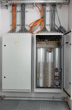 Switching panel with a plurality of optical cables is in the server room in data Stock Photos