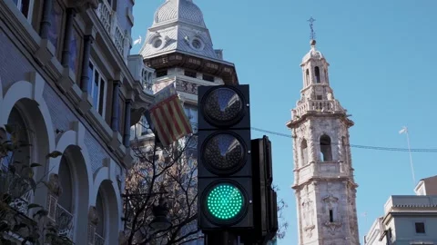 Switching traffic lights against a backdrop of an old European bell tower Stock Footage 260737247