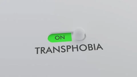 Switching on the TRANSPHOBIA switch Stock Footage 256969262