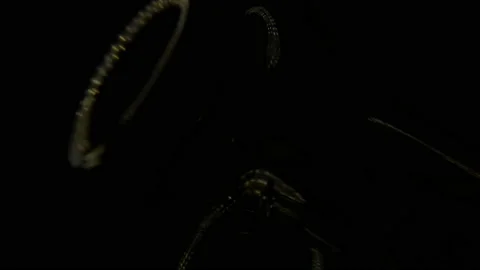 Switching on, turning off light bulb. Warm yellow light over dark black Stock Footage 206848821