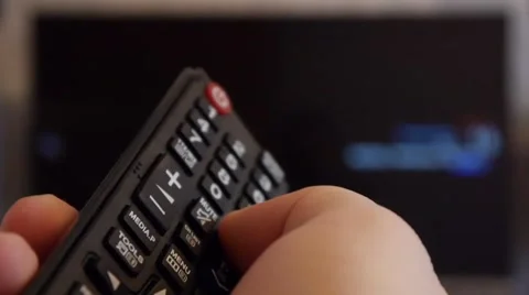 Switching TV channels with the remote 1 Video stock 47326142