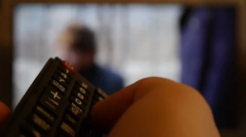 Switching TV channels with the remote 2 Stock Footage 47326151