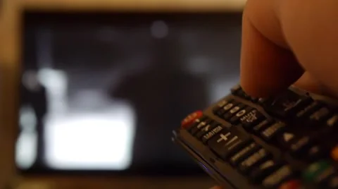 Switching TV channels with the remote 3 Vídeos de archivo 47326147