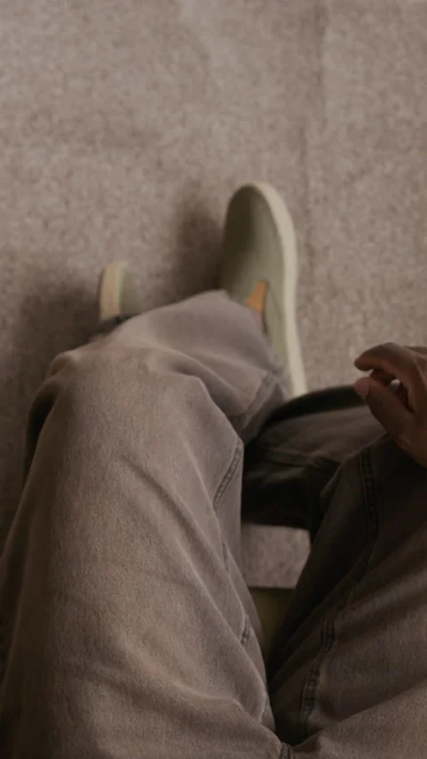 Switching on TV, Taking Potato Chips and Checking Messages in Smartphone Video stock 316919032