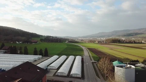 Switzerland. Green fields in a small town. Cars driving on the road. Beautiful Stock Footage 103790041