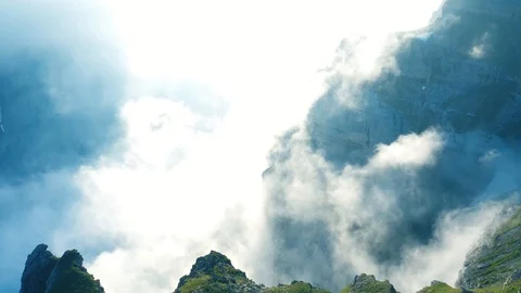 Switzerland steep mountains with clouds Stock Footage 113114460