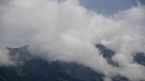 Switzerland Timelapse of Clouds Forming over Grindlewald near Jungfrau Summit Stock Footage 80604155
