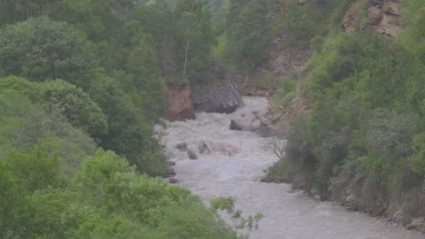 Swollen mountain river 24 30 FPS Stock Footage 157731657
