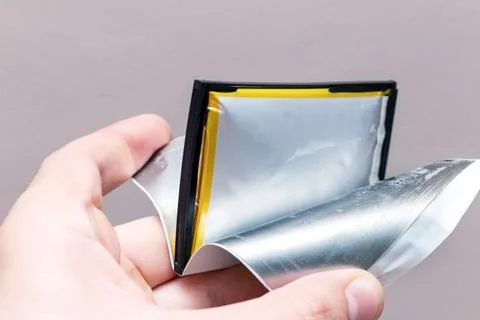 Swollen ready to catch fire or explode a broken battery on the phone Stock Photos