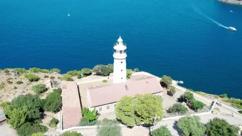 Swooping circular drone footage of lighthouse, Port De Soller Video stock 229008870