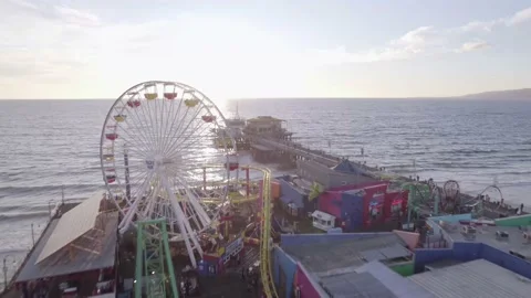 Swooping over the Roller Coaster on the Santa Monica Pier  Stock Footage 233937248