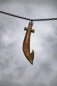 Sword hanging on a chain Stock Photos