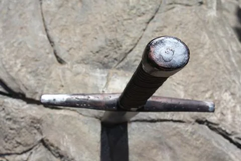 Sword in stone. Stone background. Pattern stone wall background. Natural texture Stock Photos