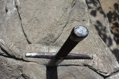 Sword in stone. Stone background. Pattern stone wall background. Natural texture Stock Photos