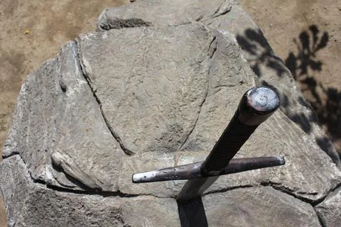 Sword in stone. Stone background. Pattern stone wall background. Natural texture Stock Photos