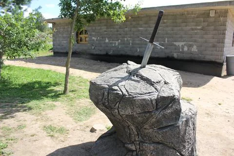 Sword in stone. Stone background. Pattern stone wall background. Natural texture Stock Photos