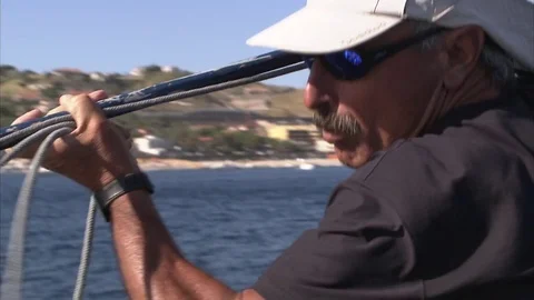 Swordfish hunter at the end of the catwalk prepares the harpoon to hit the fish Stock Footage 79753768