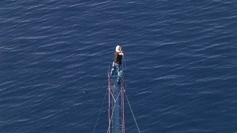 Swordfish hunter throws the harpoon and hit the fish in the water Stock Footage 79753864