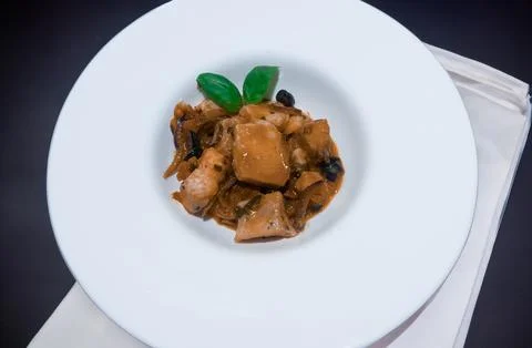 Swordfish steaks with capers and basil, Sicilian dish. Stock Photos