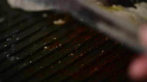 Swordfish Xiphais gladius steak portion cooking on a grill pan Stock Footage 153312835