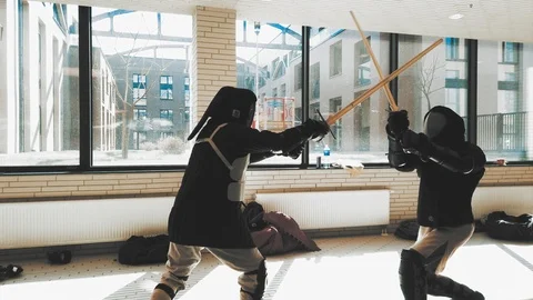 Swordsman fighting. Kendo practice. Duel sword combat training Stock Footage 106453385