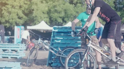 Сyclist doing jump MTB tricks bicycle HD high speed video. Mountain bike trial Stock Footage 67861422