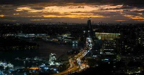 Sydney ANZAC Bridge sunset timelapse, showing traffic moving to darling harbour Video stock 236679344