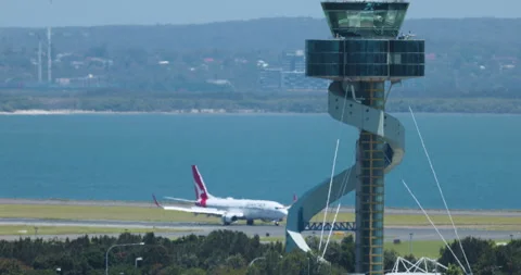 Sydney, Australia - circa 2020s, Qantas Boeing 737 taxis, Control tower Airport Stock Footage 170155084