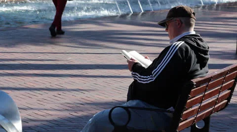 Sydney CBD Man On Bench Reading Book Video stock 25608584
