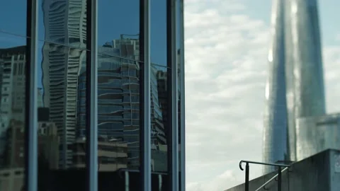 Sydney cityscape reflected on windows and Crown Casino skyscrsaper slomo Stock Footage 202077026