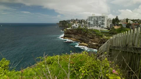 From a Sydney cliff edge with View of VAUCLUSE SURROUNDING AREA 6k Stock Footage 297592407