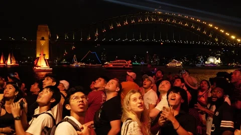 Sydney crowd suddenly turn around, night Australia Day celebrations 6K Stock Footage 330447546
