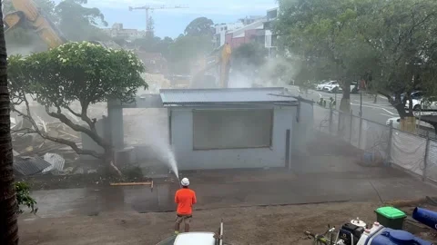 Sydney Demolition Hosing Down The Dust, sped up with sound 4K Stock Footage 329898905