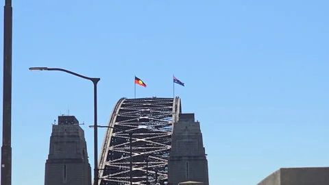 Sydney Harbour Bridge flying the Aboriginal and Australian flags together Stock Footage 322556471