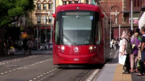 Sydney Light Rail train picks up passengers and moves on.  Time Lapse Stock-Footage 62875937