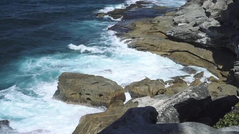 Sydney - March 2018: Waves and rocky coast at Watsons Bay. Slow motion tilting. Stock Footage 111711204
