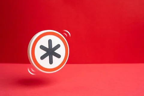 A symbol with an asterisk on a red background. Hidden terms and pitfalls in.. Fotos de archivo