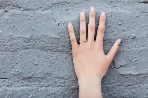 The symbol of commitment. Cropped shot of an engagement ring on an unrecogniz Stock Photos
